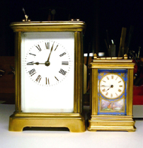 comparing size of a miniature carriage clock with a standard size carriage clock